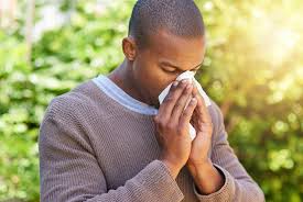 Man sneezing into napkin helps to stop spread virus 